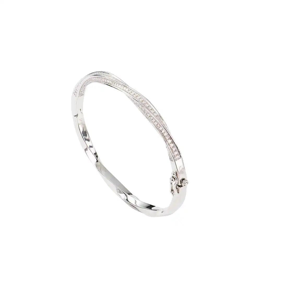 Mozi Mobius Moissanite Bangle featuring a sleek S925 silver design with a Mobius twist and sparkling moissanite stones, displayed against a white background