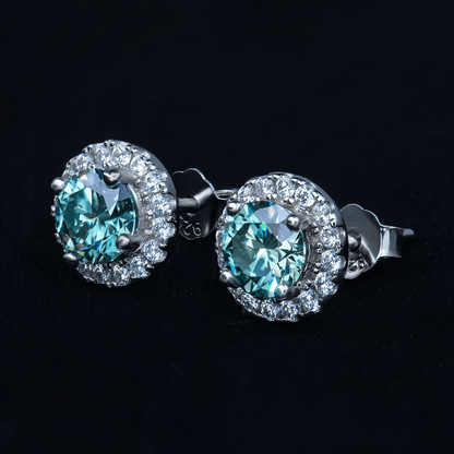 Side view of Round Brilliant Sea Blue Earrings showcasing their sterling silver setting.