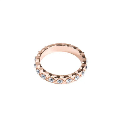 The Mozi Blush Brilliance Ring laying flat, showcasing the full circle of VVS1 Moissanite stones set in the Rose Gold-plated band.