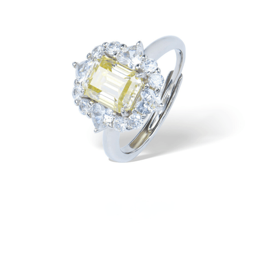 Champagne Radiance Adjustable Ring from the Sparkle Collection, featuring an emerald-cut champagne Moissanite surrounded by sparkling accents, displayed on a white background.