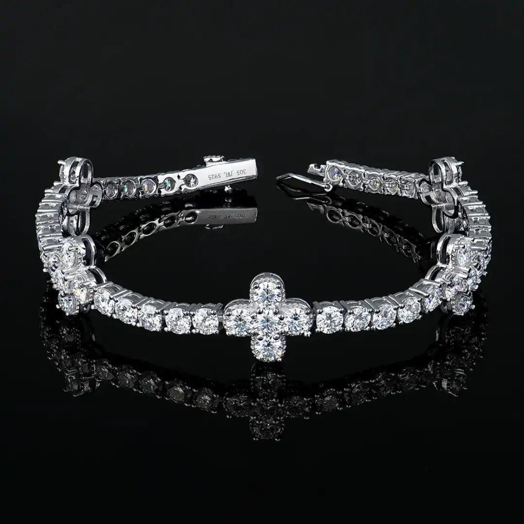 Mozi Four-Leaf Clover Tennis Bracelet displayed on a black background, emphasizing the brilliant sparkle of the white moissanite stones and the unique clover-inspired design.