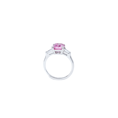 Side look , Sakura Emerald Adjustable Ring from the Sparkle Collection, featuring an emerald-cut pink Moissanite set in sterling silver with sparkling accents, displayed on a white background.