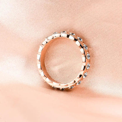 Side view of the Mozi Blush Brilliance Ring, showing the intricate detailing of the geometric design and the brilliance of the Moissanite stones.