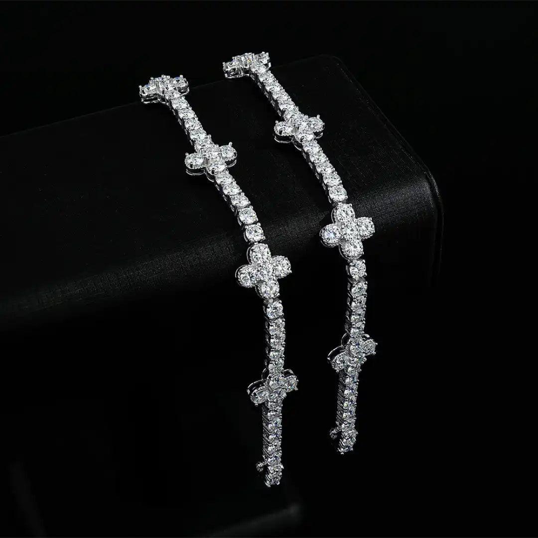 Mozi Four-Leaf Clover Tennis Bracelet displayed vertically, highlighting the luxurious design and the radiant white moissanite stones in a four-leaf clover-inspired pattern