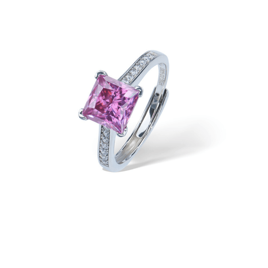 Pink Princess Adjustable Ring from the Sparkle Collection, featuring a princess-cut pink Moissanite set in sterling silver with sparkling accents, displayed on a white background.