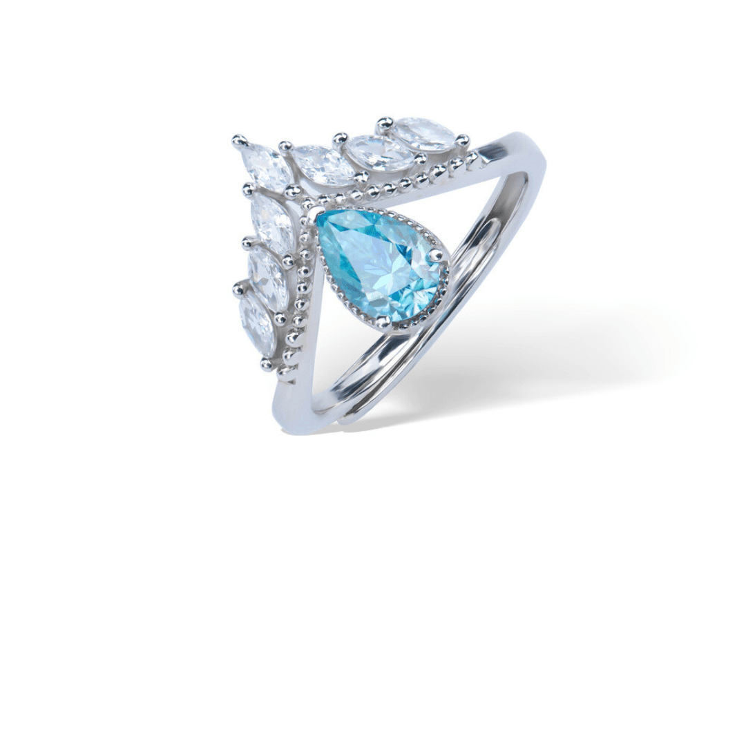 Sea Blue Adjustable Ring from the Sparkle Collection, featuring a pear-shaped sea blue Moissanite surrounded by dazzling accents, displayed on a white background.