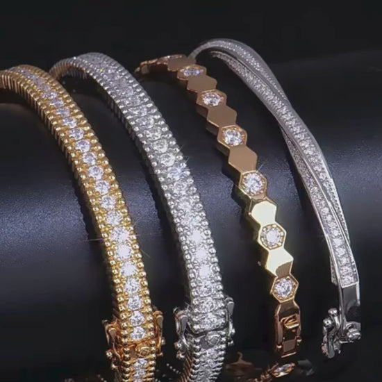 A video showcasing the elegant Mozi Celestial Moissanite Bangles in both gold and silver, highlighting their sparkling moissanite stones and detailed craftsmanship from various angles.