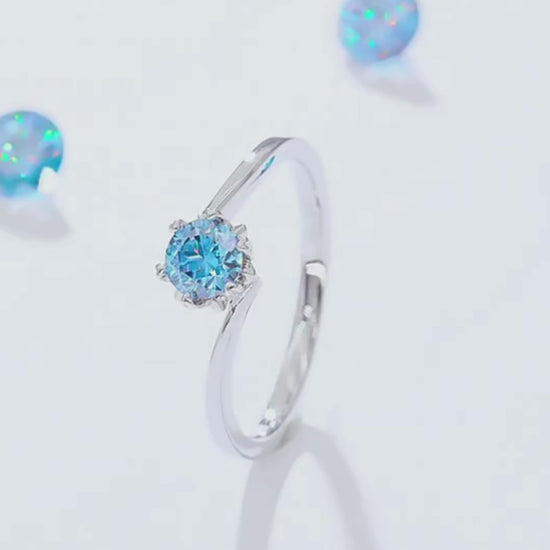 A collection of Blue Flower Moissanite Rings featuring various Moissanite colors set in a delicate floral design.