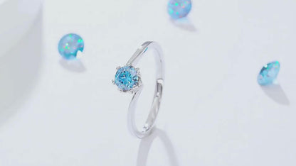 A collection of Blue Flower Moissanite Rings featuring various Moissanite colors set in a delicate floral design.