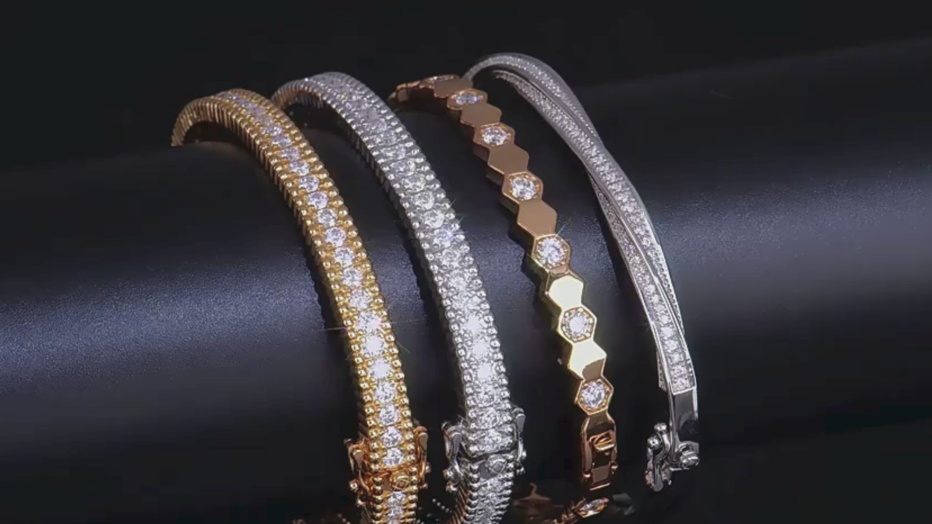 A video showcasing the elegant Mozi Celestial Moissanite Bangles in both gold and silver, highlighting their sparkling moissanite stones and detailed craftsmanship from various angles.