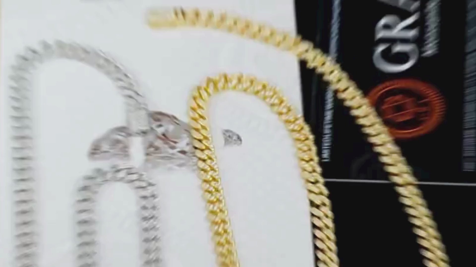 Video showcasing the Miami Moissanite Cuban Necklace (Slim Edition) with the diamond tester, highlighting its 6mm slim design, brilliant Moissanite gemstones, and sterling silver 925 craftsmanship. Suitable for hip hop and street style.